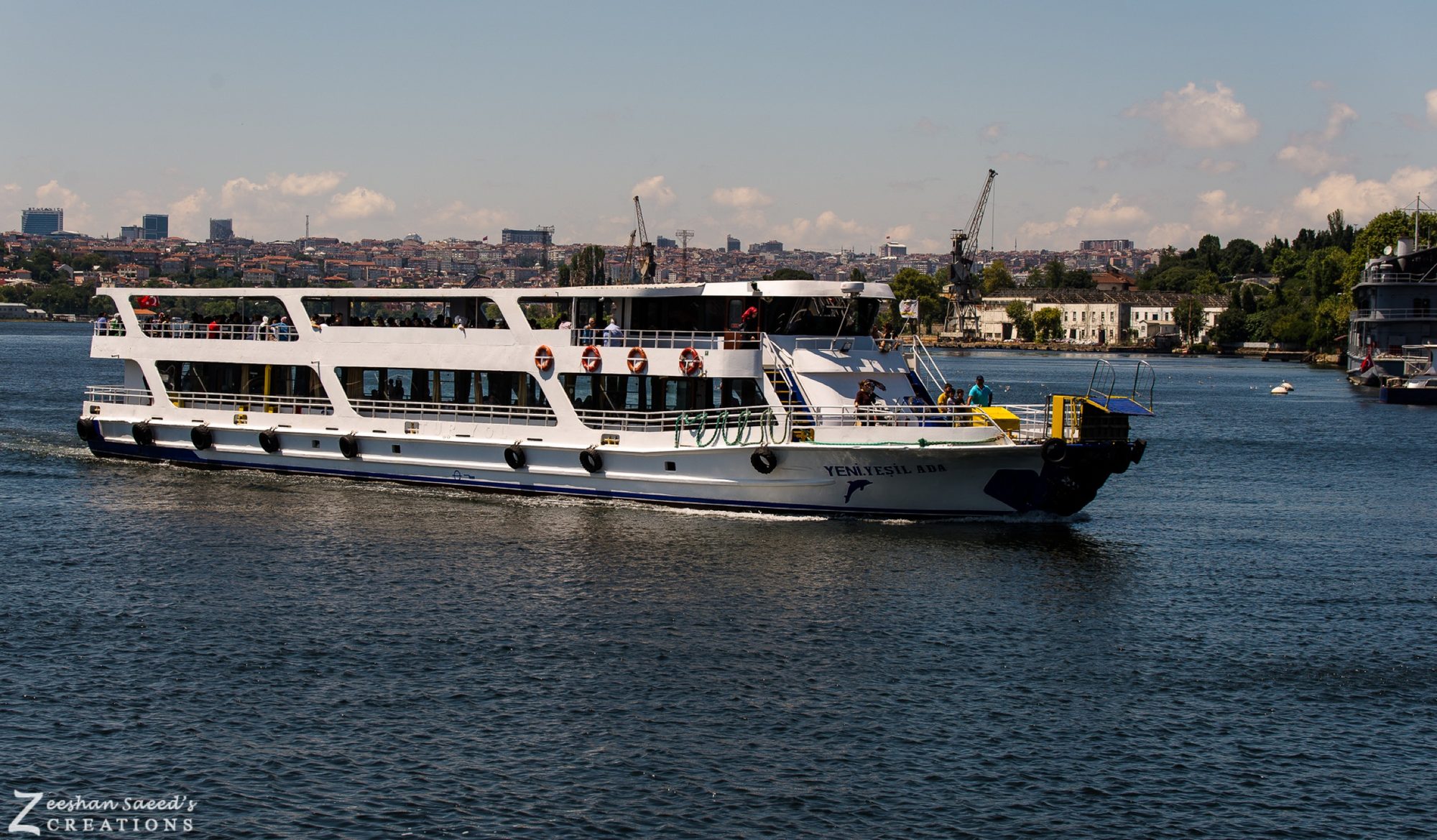 A Golden Horn ferry passing the old shipyard cranes