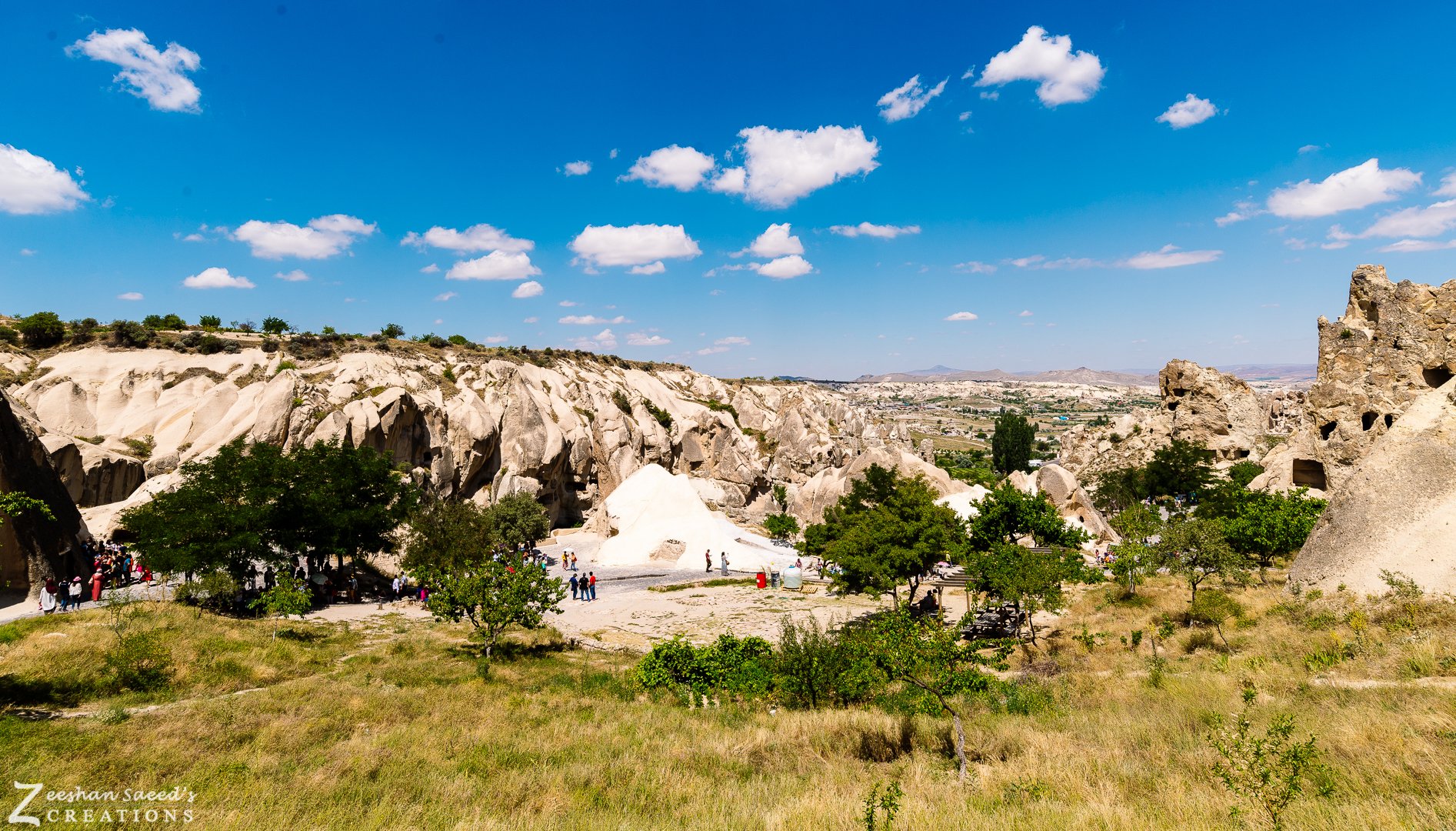 Rose-coloured rock valley under a blue sky